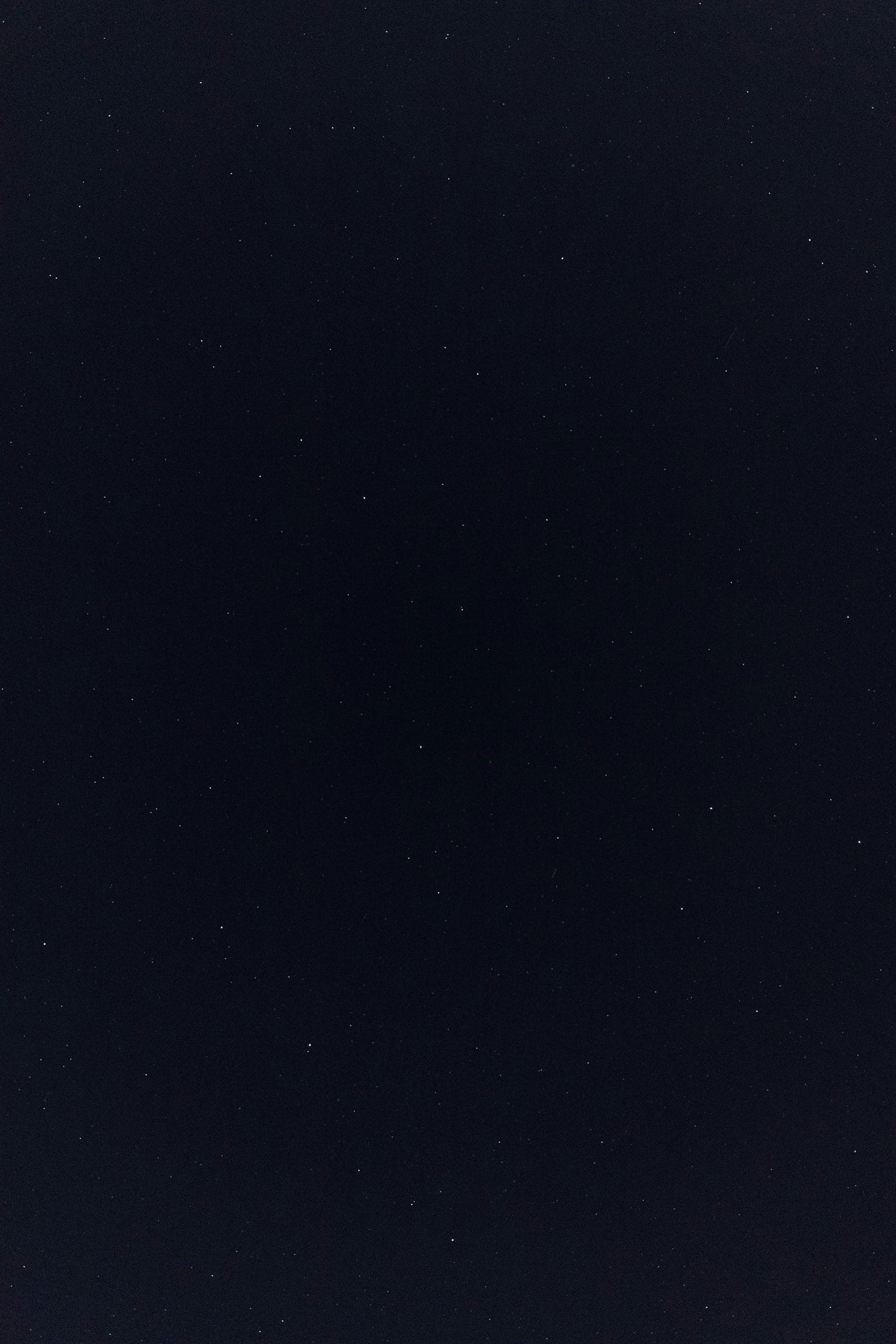 a night sky with a few stars in it